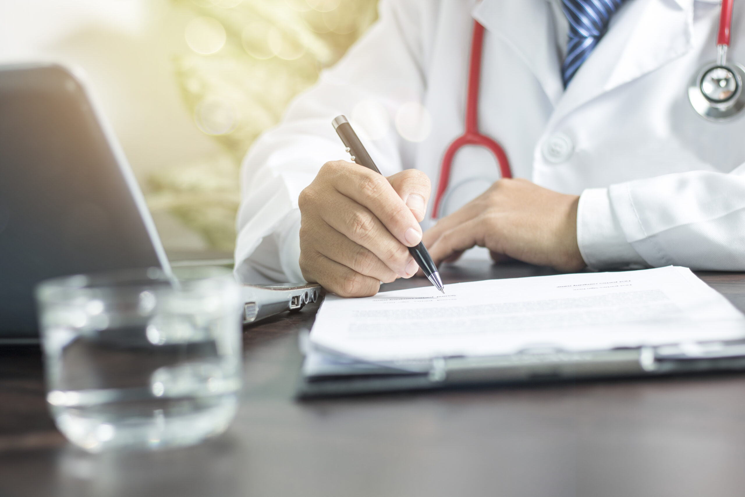 doctor writing information to patient on medicine paper for planning to take care good healthty